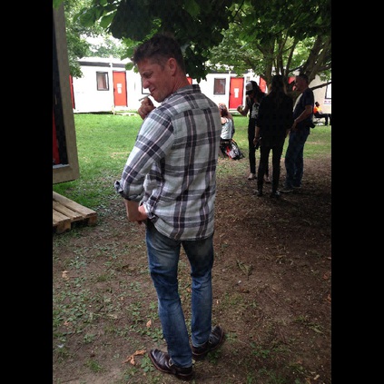 The Ramblin Rogue Ian Williamson in his Ramblin Man boots, with special appearance of Cadillac Three in the background!