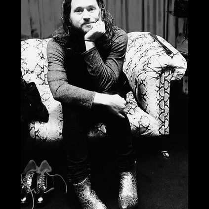 Reptilian Jay Buchanan of Rival Sons wearing Smaug Big Bangboots